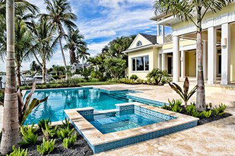 Screened lanai pool with paver deck in St. Augustine, FL